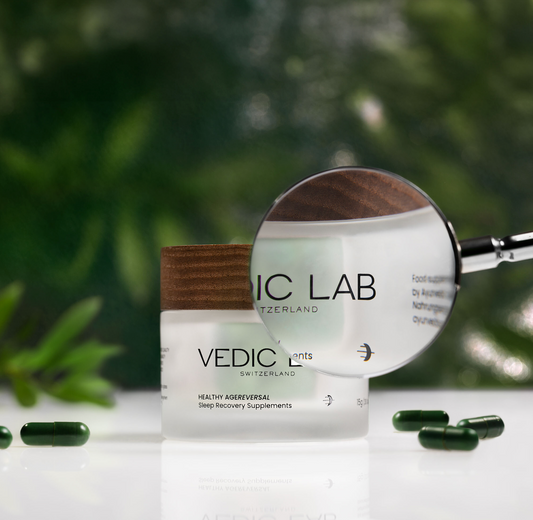 Vedic Lab sleep recovery supplement jar with magnifying glass. Green capsules visible. Leafy background.